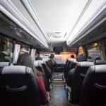 View from back seat in a bus. passengers in the public bus,